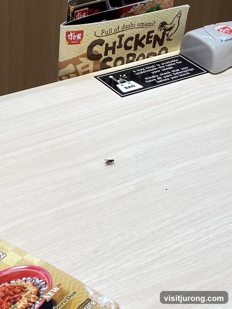 Table with Menu and Bag Hook Sign