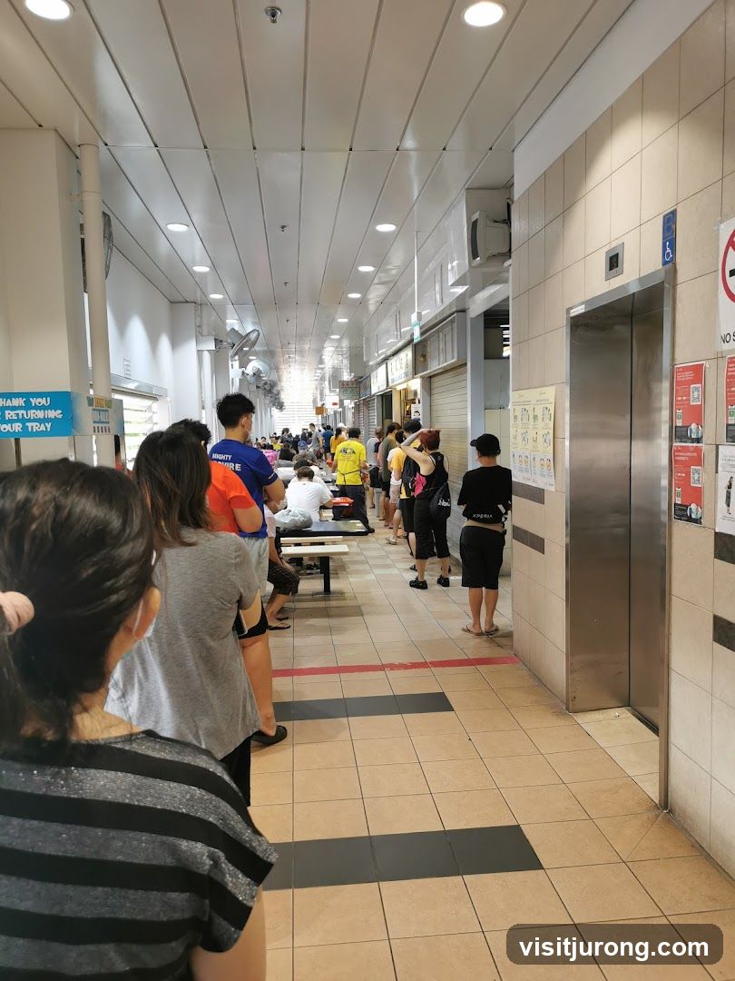 People queuing in a covered walkway