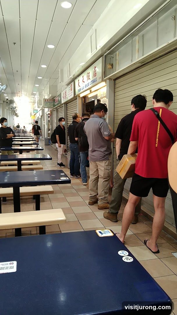 People queuing at a food stall