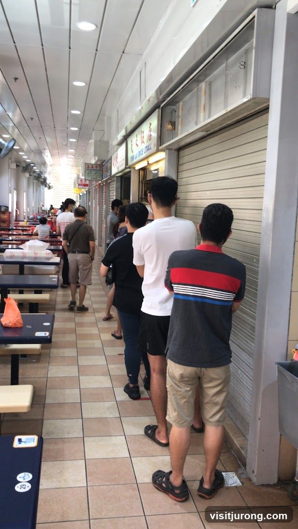 People queuing at a food stall