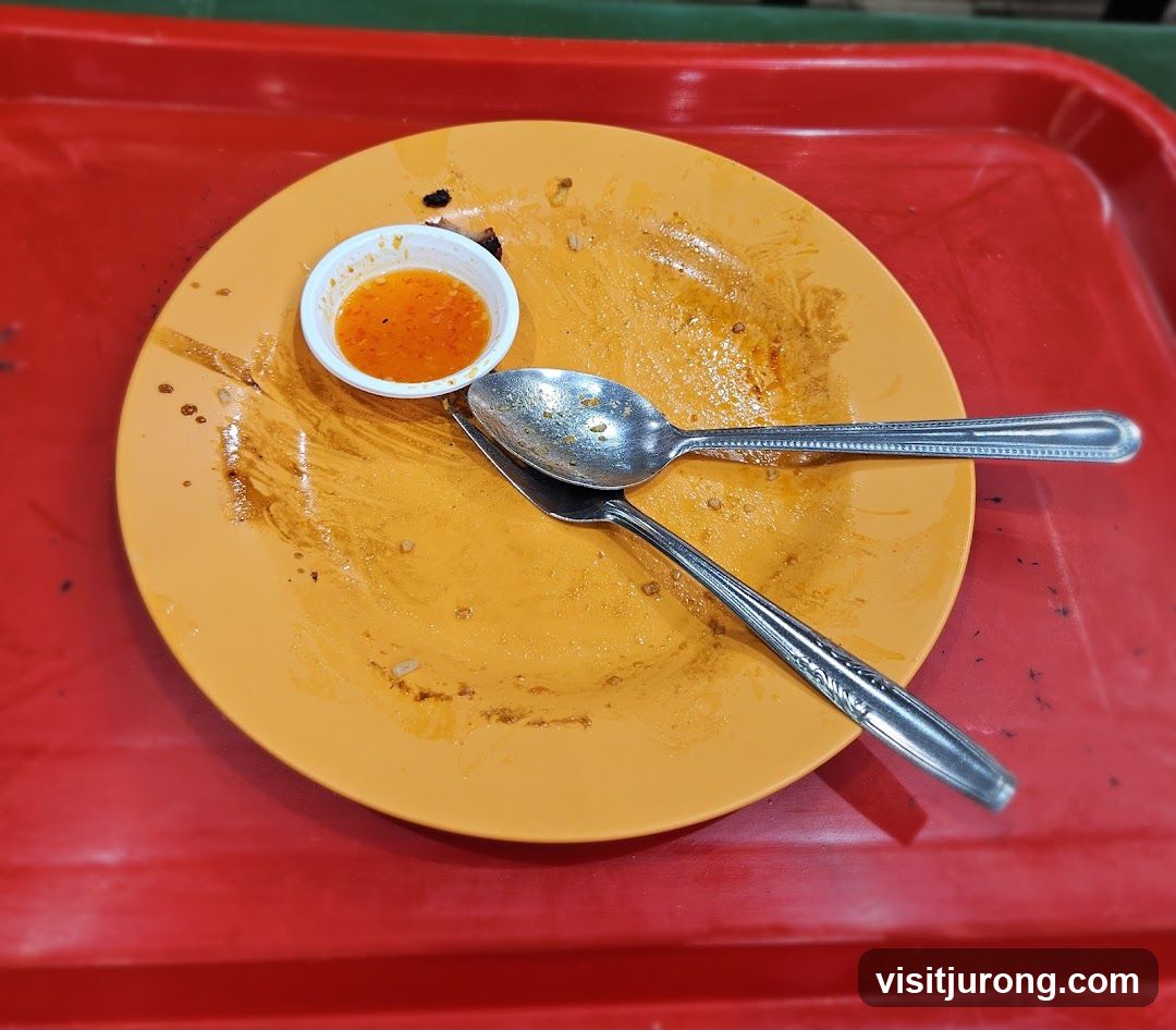 Dirty Plate with Sauce and Spoons