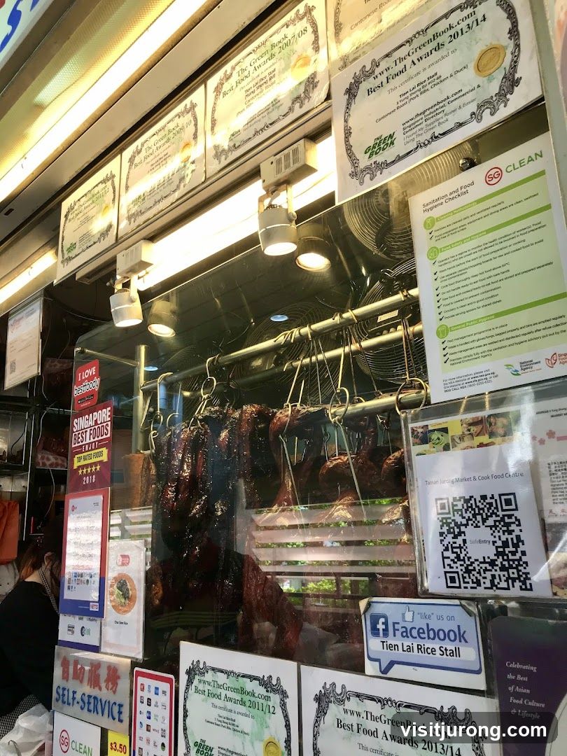 Food stall with roasted meats and awards
