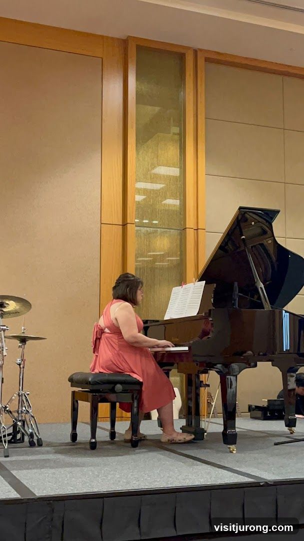 Woman playing piano on stage