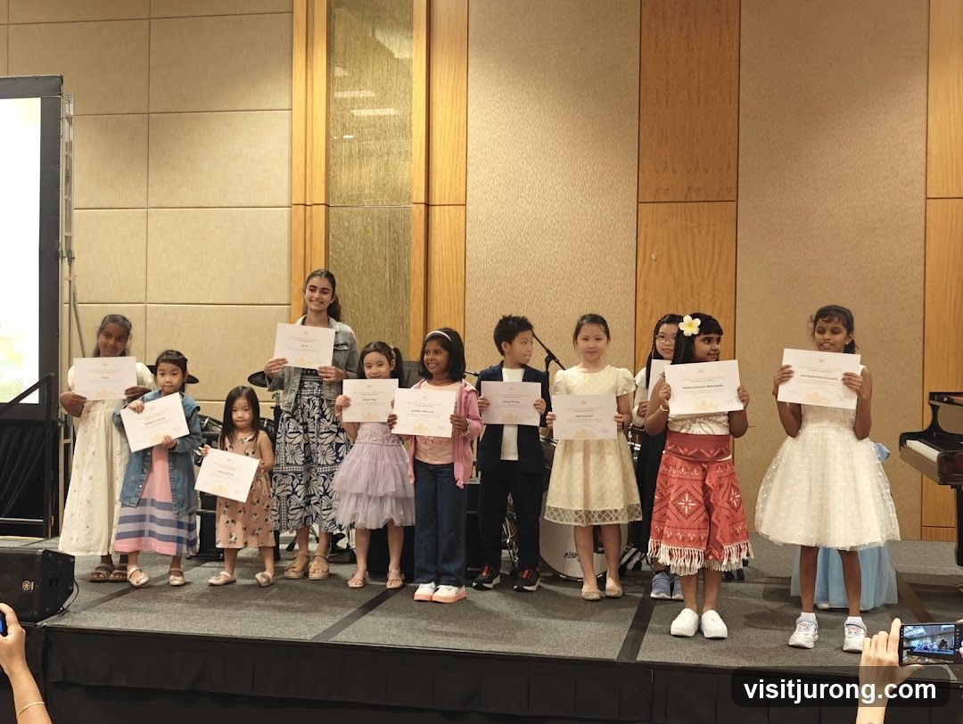 Children receiving certificates on stage