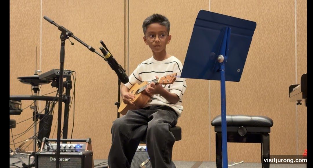 Boy playing ukulele