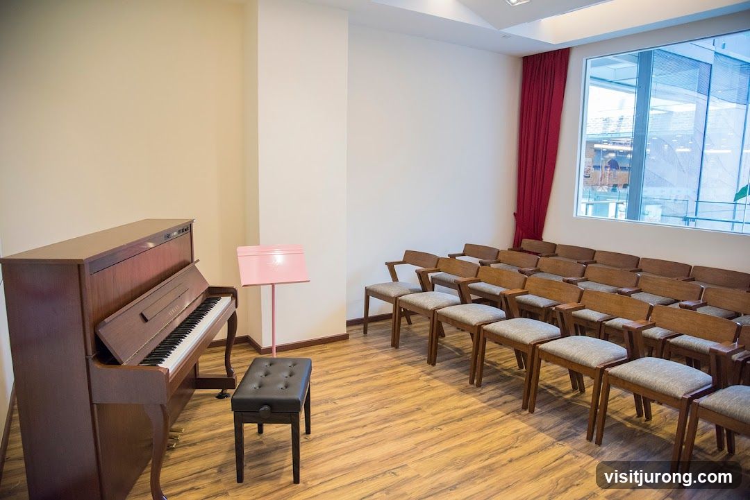 Piano practice room with seating