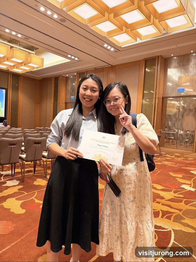 Two women holding a certificate
