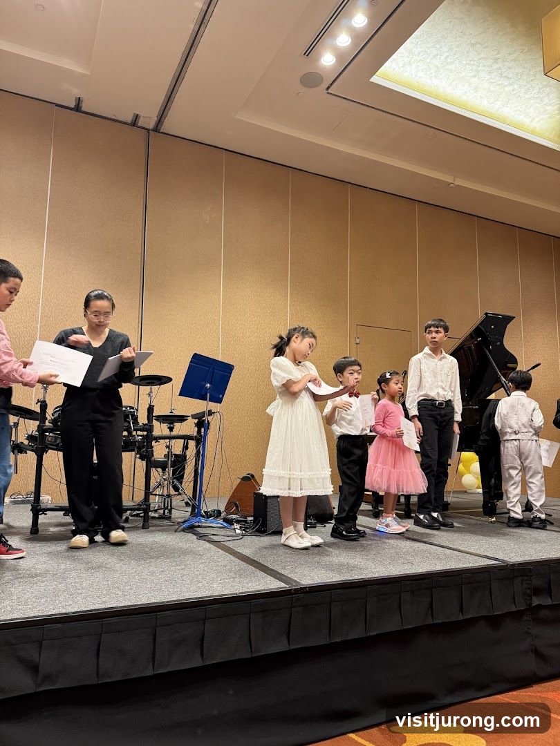 Children receiving certificates on stage