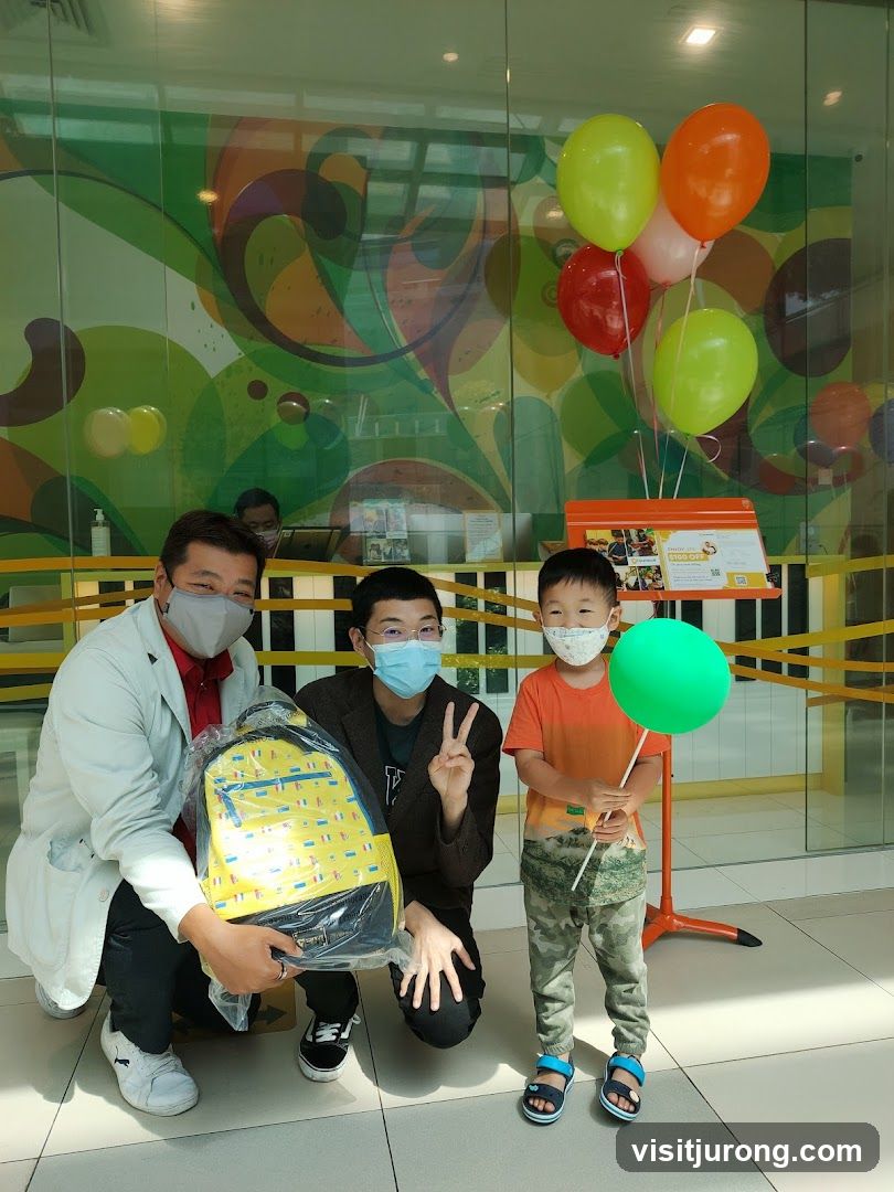 Three people with a backpack and balloons