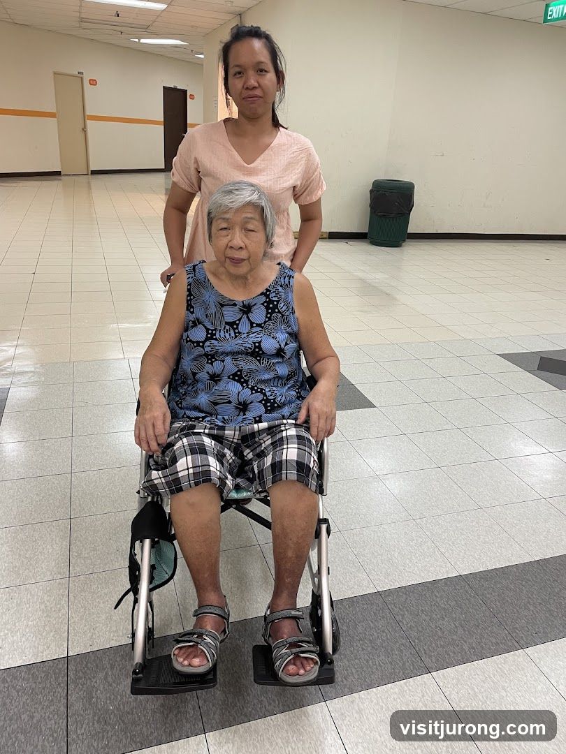 Woman Pushing Elderly Woman in Wheelchair