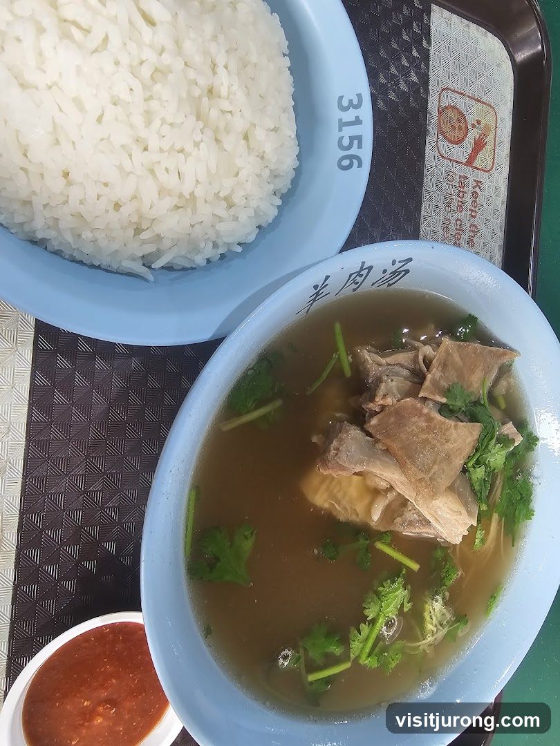 Bowl of soup with meat and rice