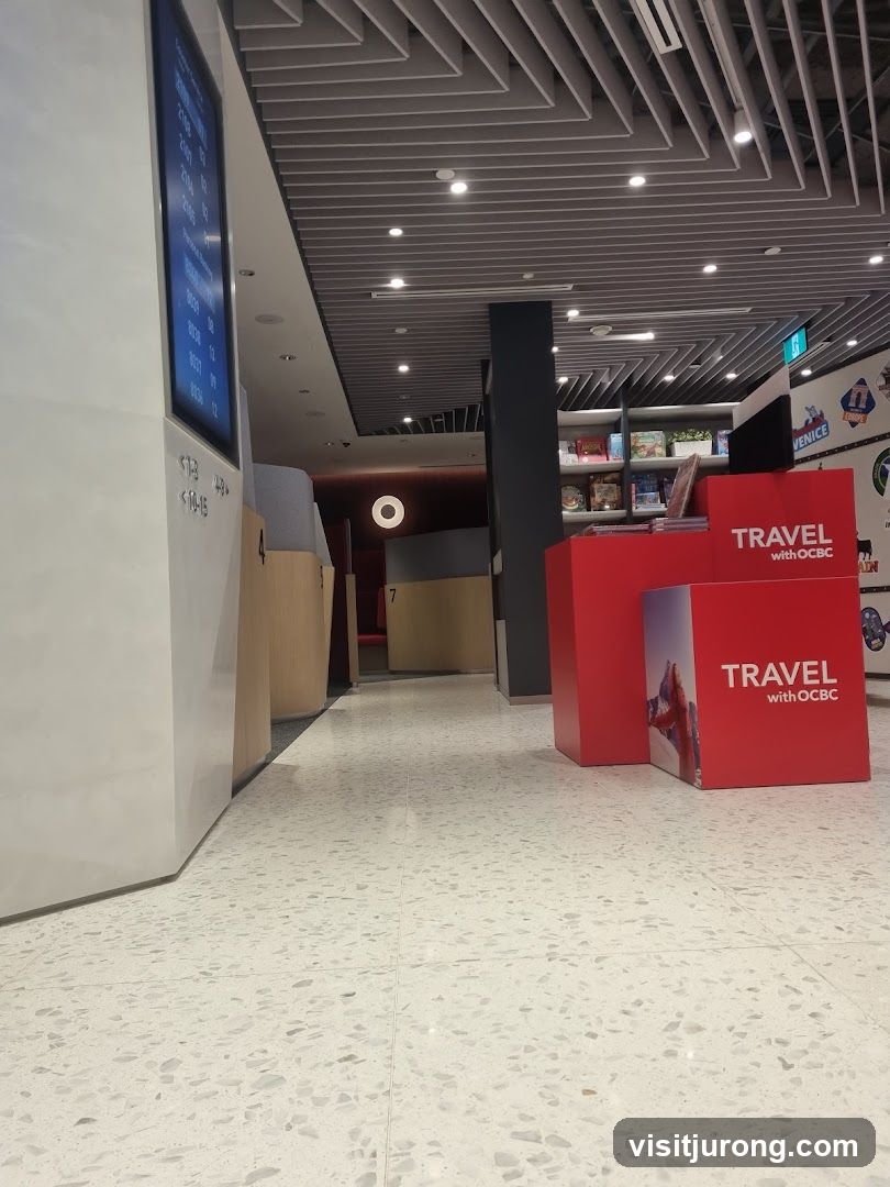 Interior of a modern office or bank with digital displays and promotional materials.