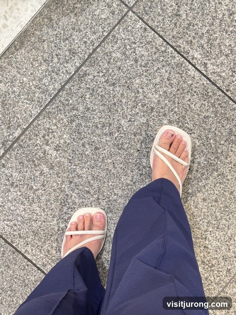 Feet in Sandals and Pants