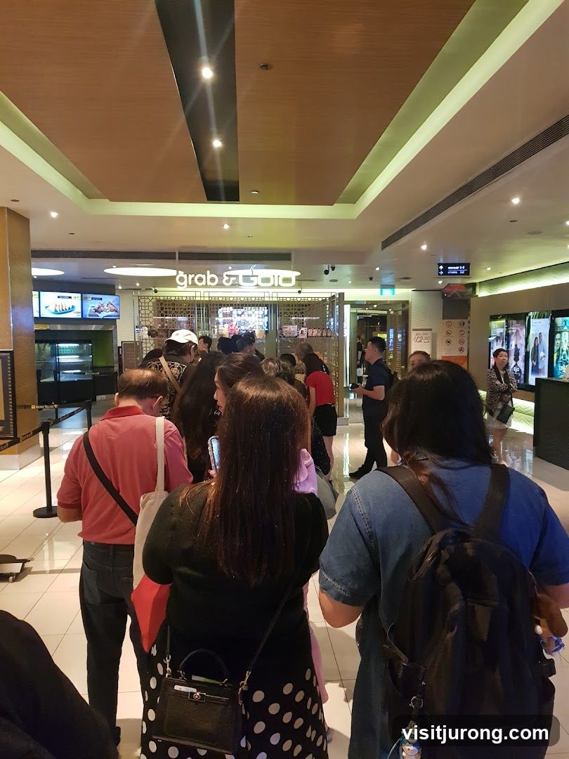 People queuing at a food counter