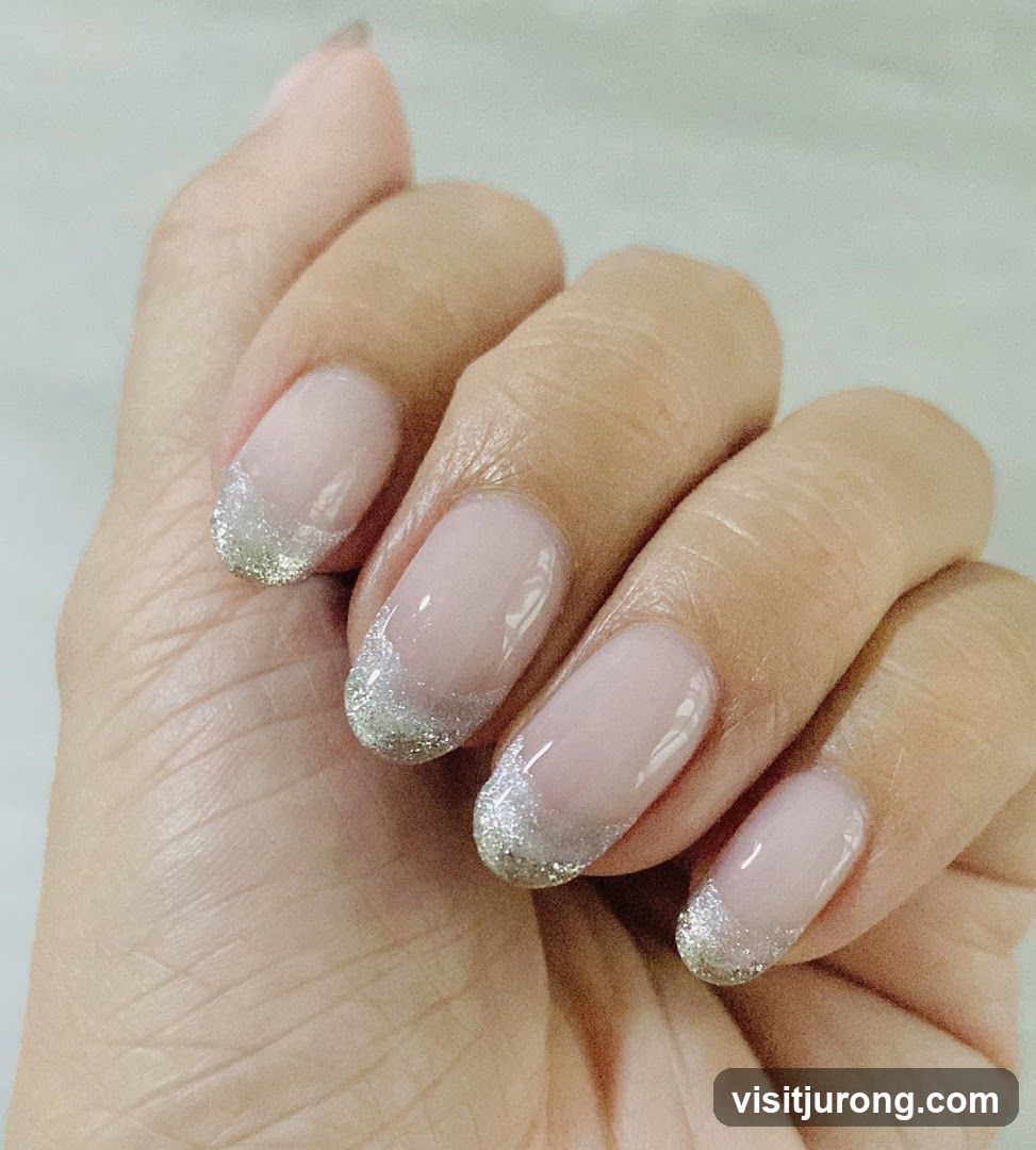 French Manicure with Glitter Accent