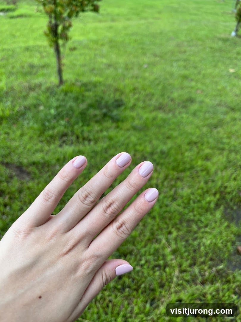 Hand with Light Pink Nail Polish