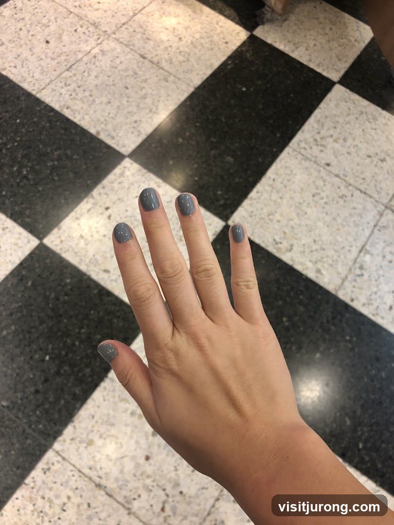 Hand with Gray Nail Polish