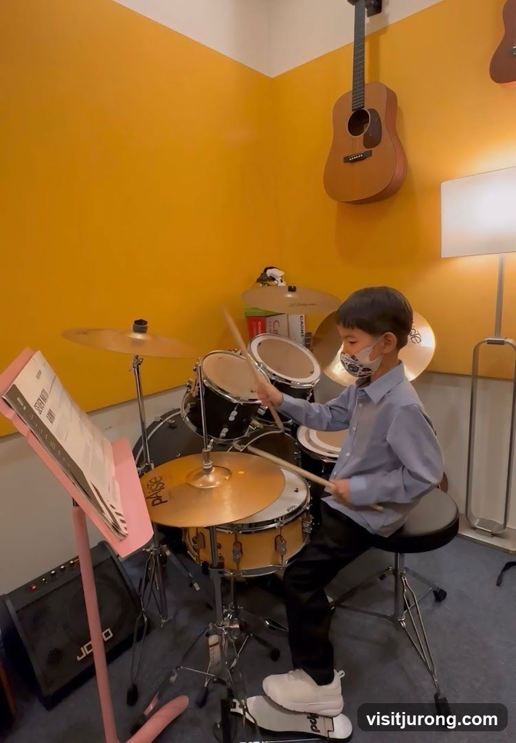 Young boy playing drums