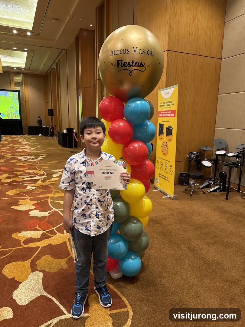 Boy with Certificate and Balloons