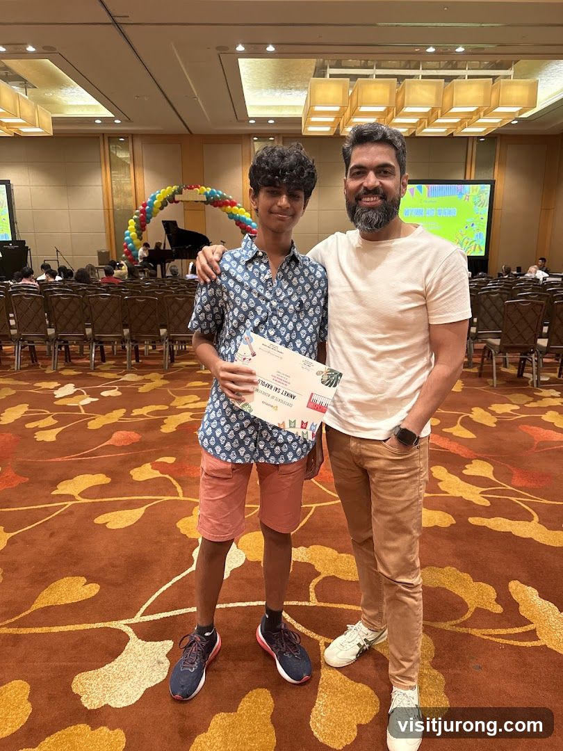 Two people posing with a certificate