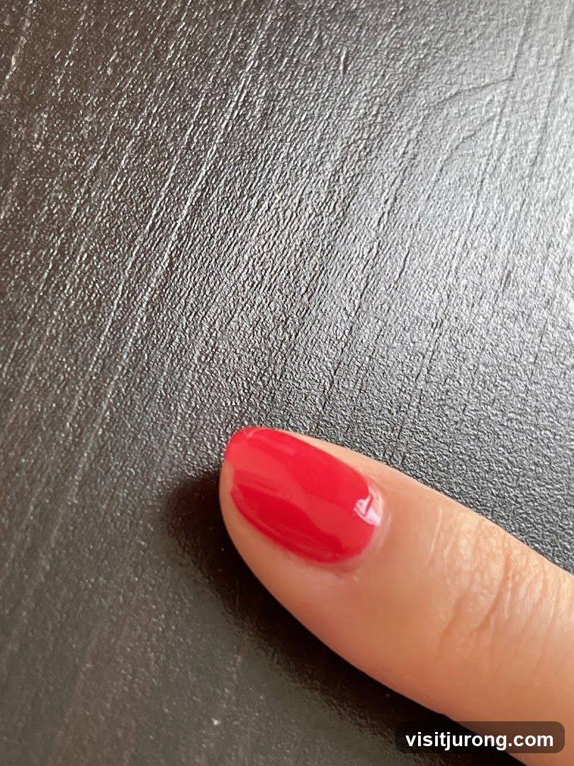 Red Nail Polish on Finger