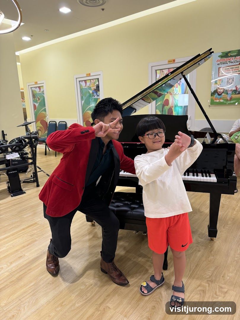 Man and child posing by a piano