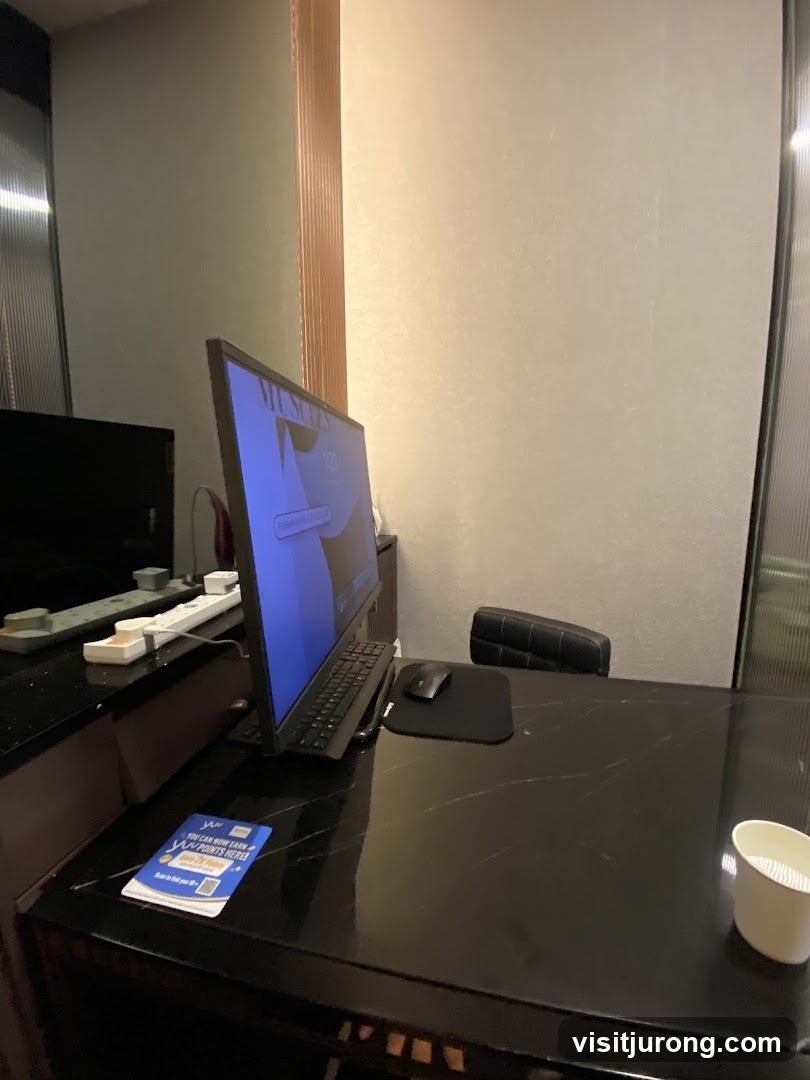 Desk with Computer and Promotional Material