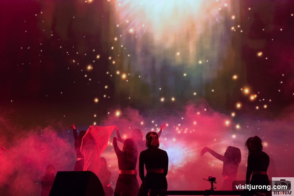 Performers on Stage with Dramatic Lighting
