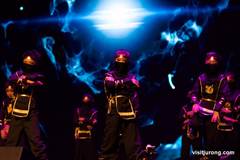 Children in Ninja Costumes Performing on Stage