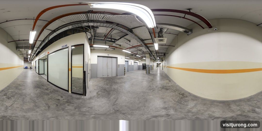 Interior of a building hallway with offices and elevators