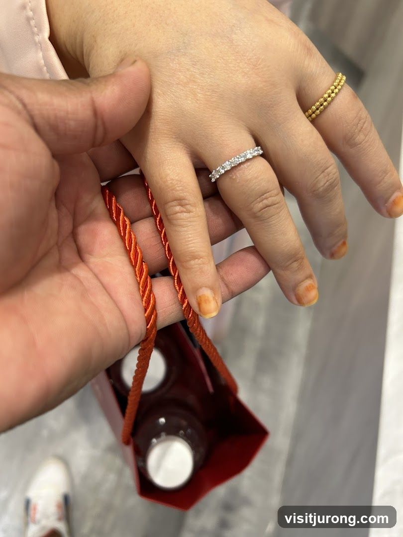 Hands holding a gift bag with rings