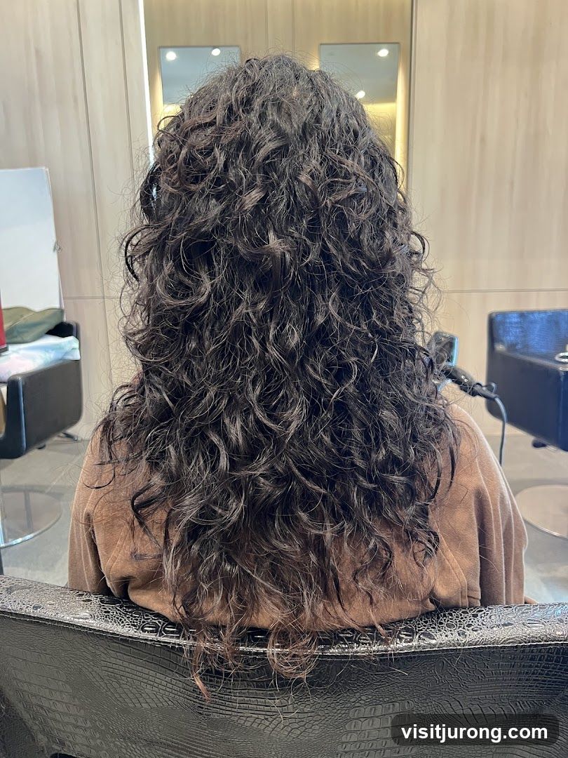 Woman with long curly dark hair