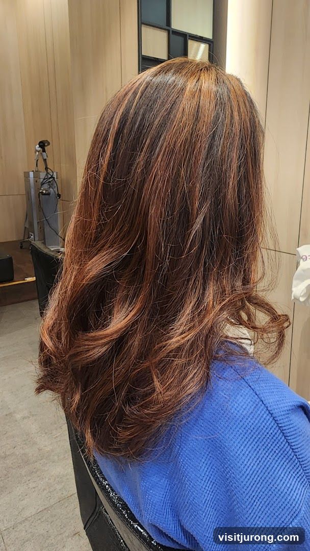 Woman with freshly styled auburn hair