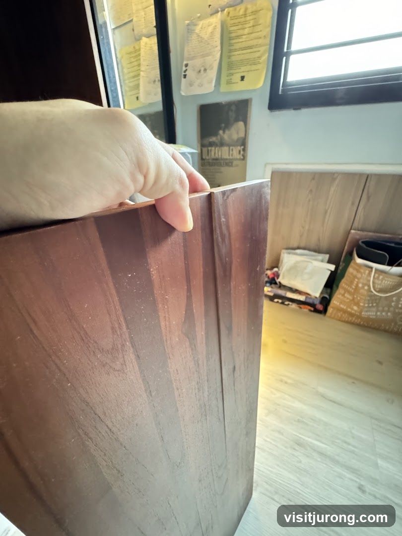 Wooden furniture and posters on wall