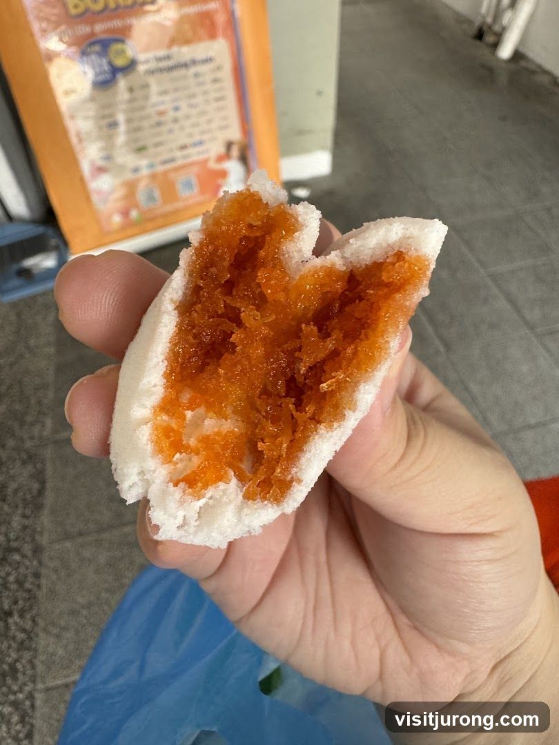 Close-up of a sweet bun with orange filling