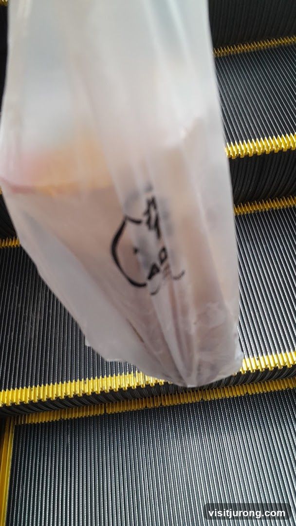 Plastic bag with logo on escalator