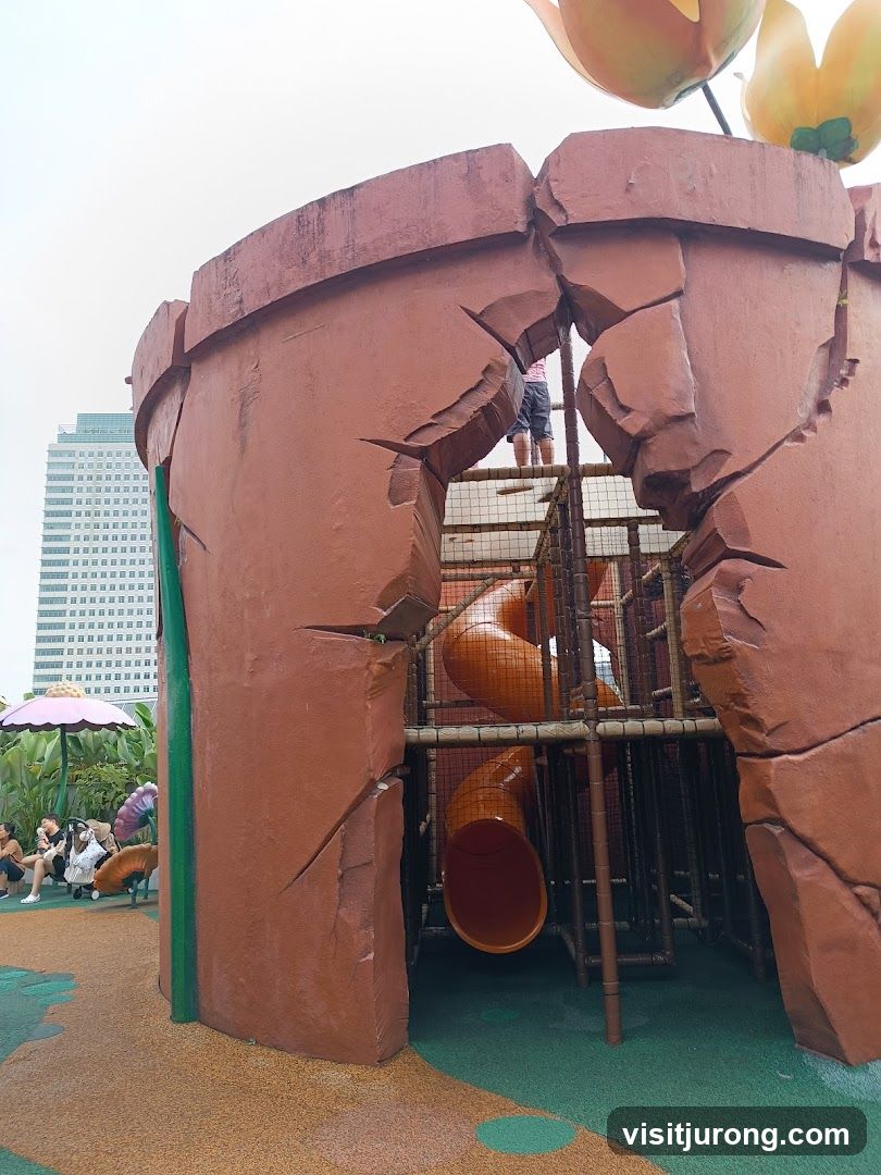 Playground structure resembling a cracked flower pot