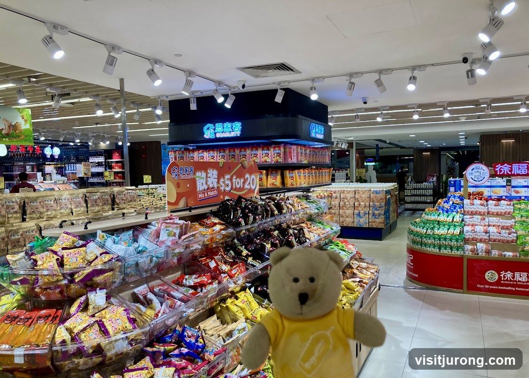 Supermarket aisle with snacks and promotional signage