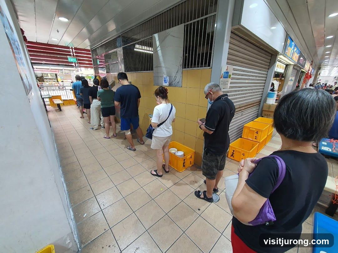 People queuing at a food stall