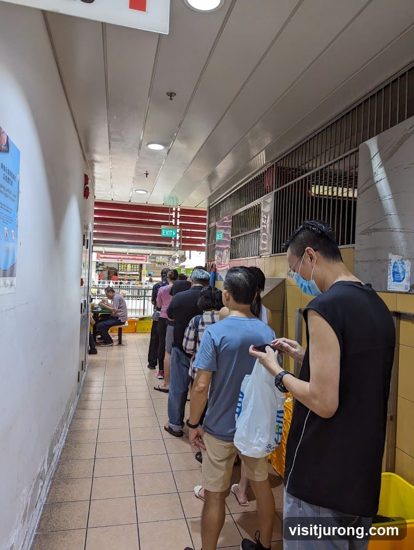 People Queuing in a Hallway