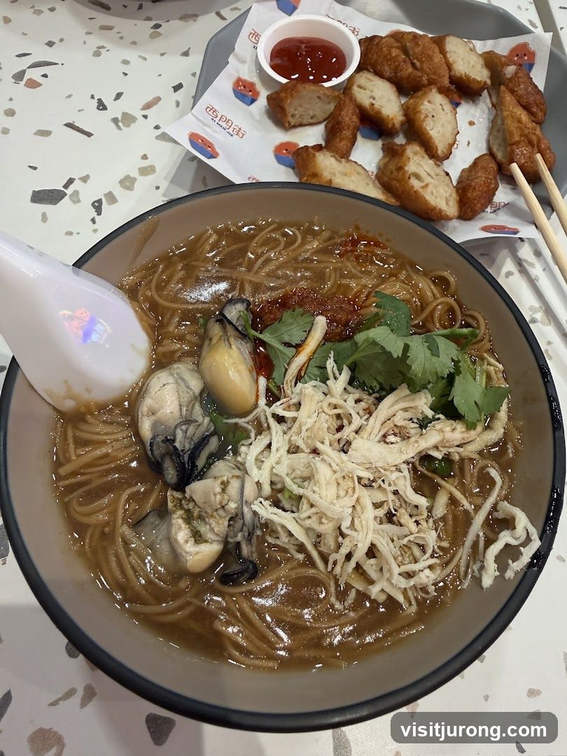 Oyster and Shredded Chicken Noodles with Fried Fish Cakes