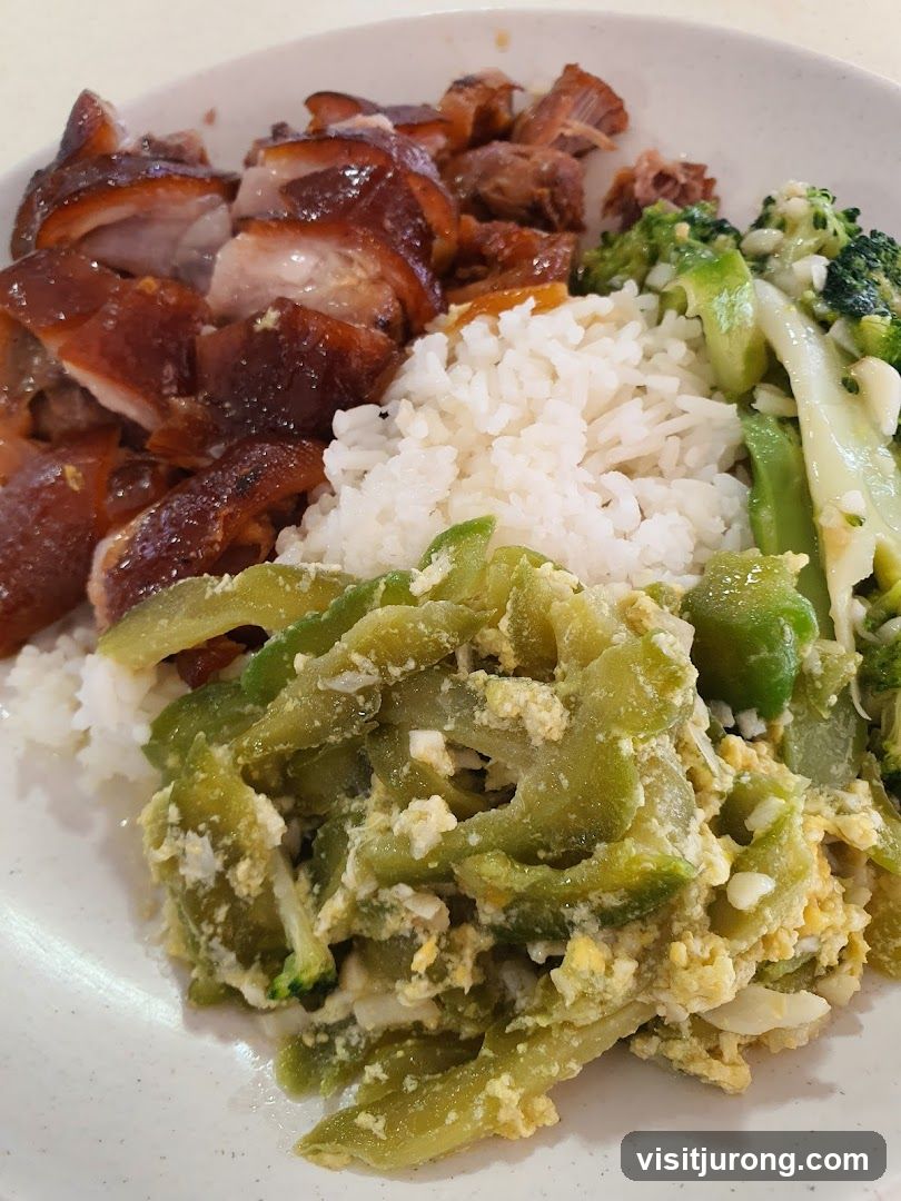 Plate of Rice with Roasted Meats and Vegetables