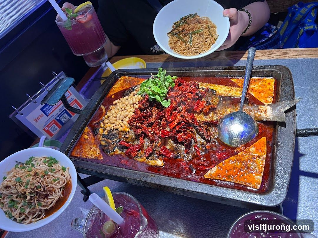 Spicy Fish Dish with Noodles and Drinks