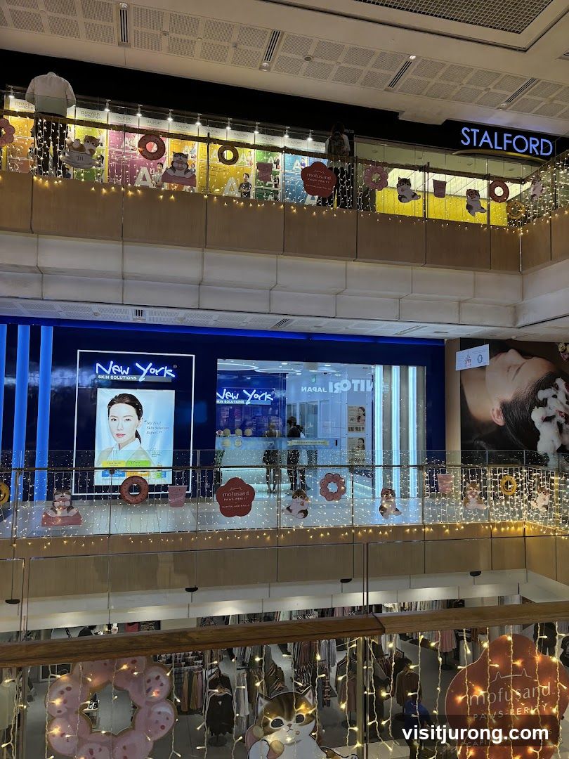 Mall Interior with Storefronts and Decorations