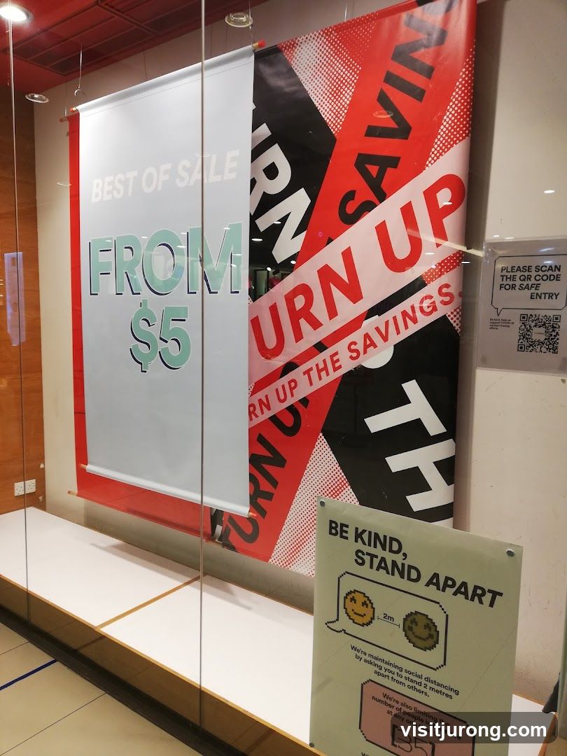 Sale Banners and Social Distancing Sign