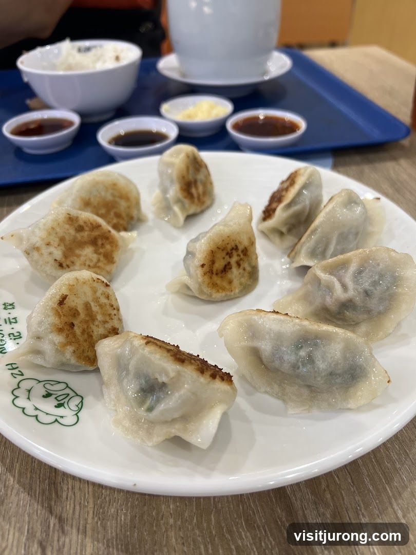 Pan-fried dumplings with dipping sauces