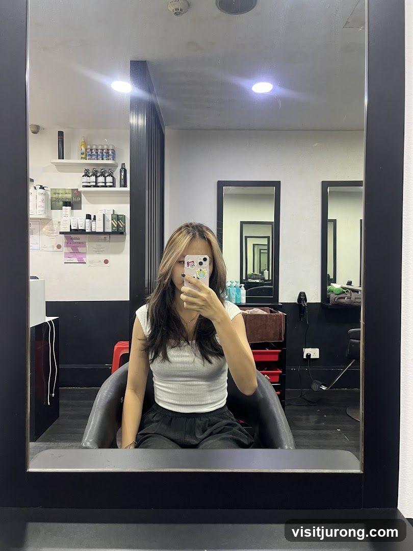 Woman taking a selfie in a salon mirror