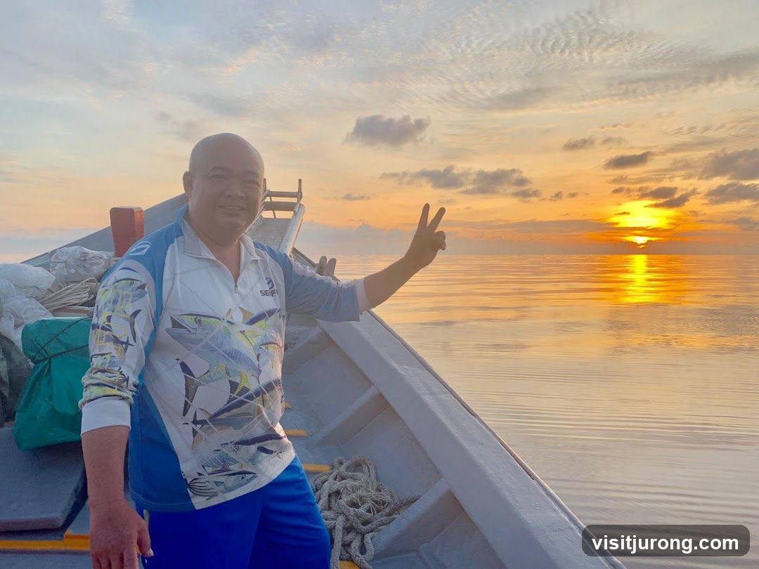 Man on a boat at sunset