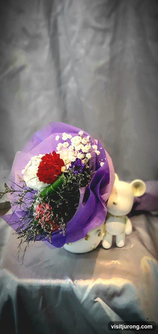 Flower bouquet with decorative bear