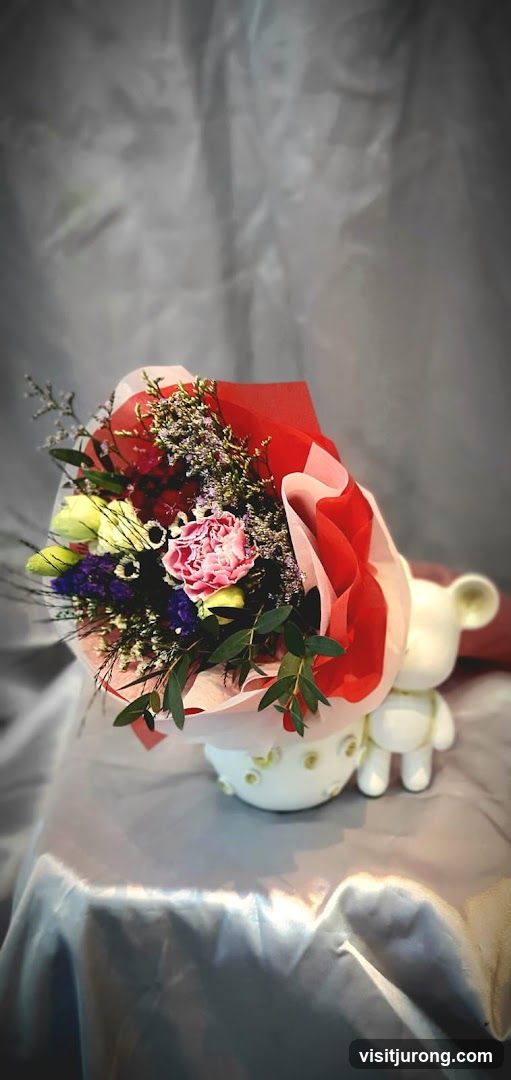 Flower Arrangement with Bear Figurine